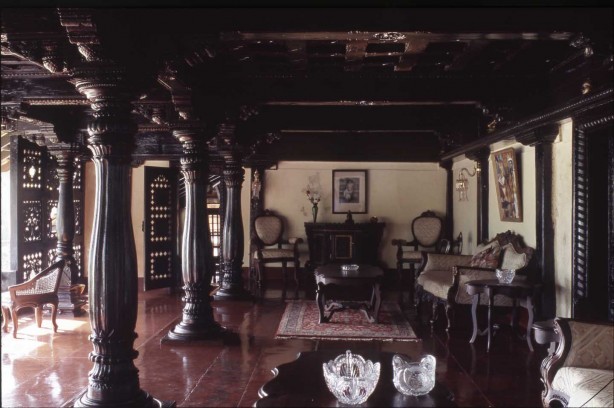 The elaborate wooden columns and carved screens of this mansion have been lovingly restored