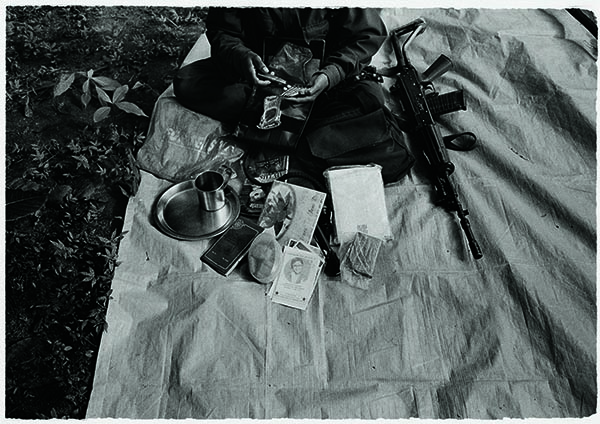 Letters from home, photographs of a sister, medicines and ammunition—a Maoist guerrilla along the Maharashtra-Chhattisgarh border in 2010 repacks her bag before leaving camp.