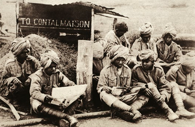 Indians Abroad Soldiers read illustrated papers in war-torn Europe